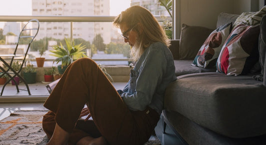 lonely looking woman sitting on the floor